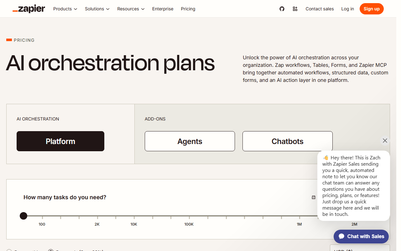 Zapier's pricing page showing the AI orchestration plan selector, task-volume slider, and a live sales chat prompt