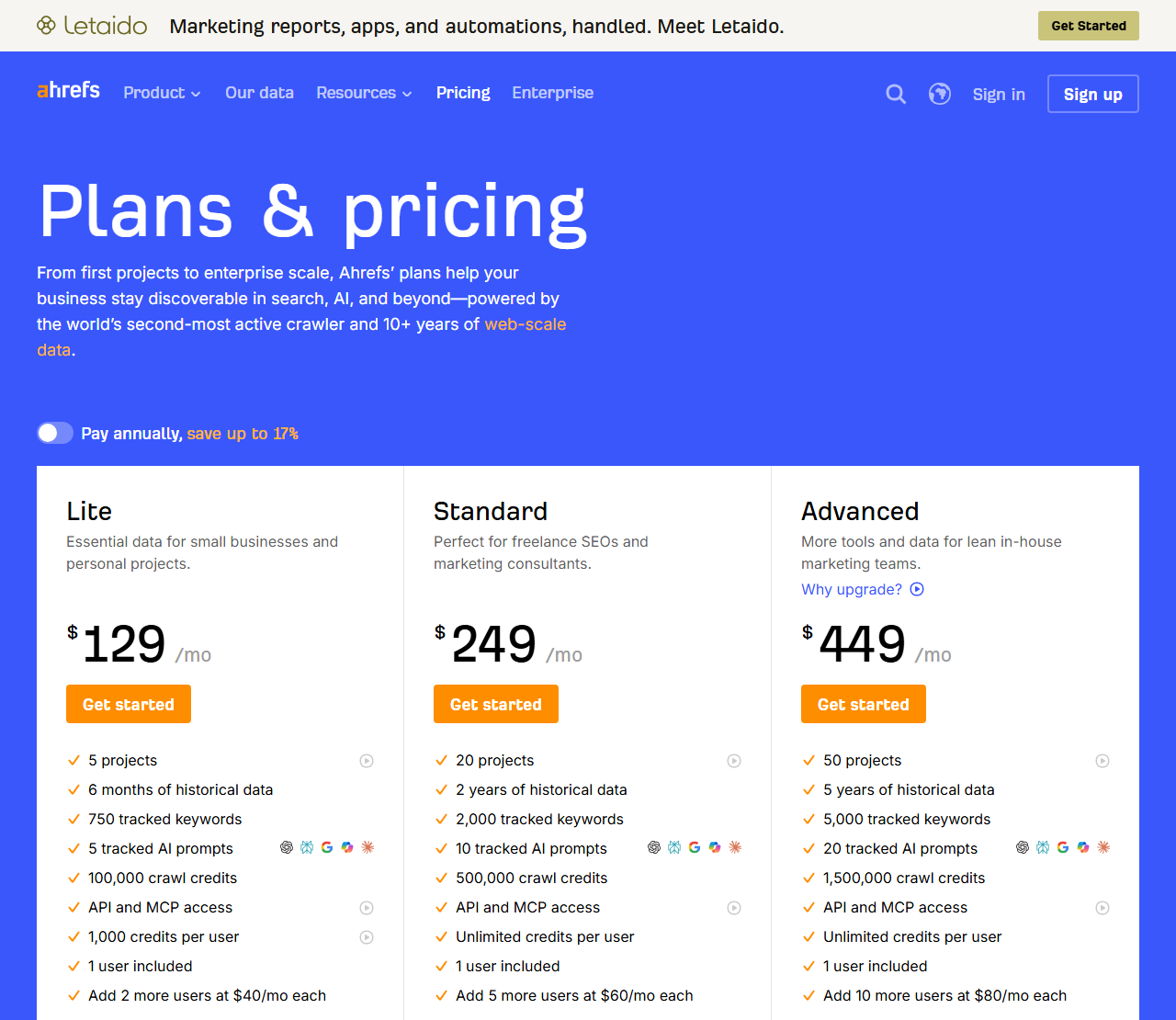 Ahrefs plan cards showing Lite at $129, Standard at $249 and Advanced at $449 a month, each ending with its extra-user price